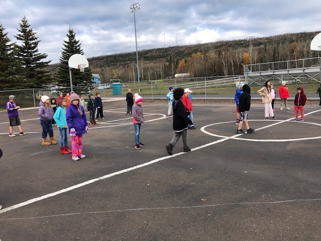 2nd & 5th Grade students playing kickball